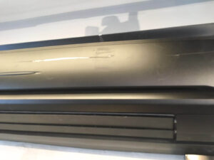 close up of a black ac wall mounted unit