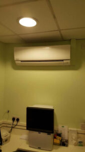 White air conditioning unit installed on a wall by PRA Air Conditioning Engineers