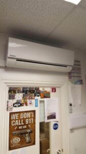 White air conditioning unit installed on a wall by PRA Air Conditioning Engineers