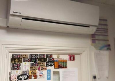 White air conditioning unit installed on a wall by PRA Air Conditioning Engineers